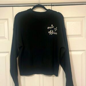A New Day “out of office” sweater